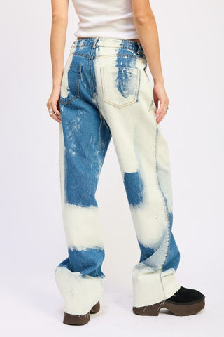 close up front pocket area bleach tie dye high waist jeans showing 5-pocket construction and white bleach dye at hip