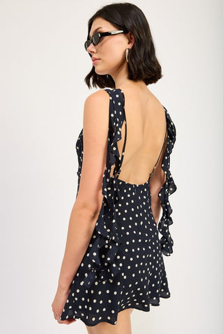 close up skirt detail black white polka dot ruffle mini dress showing cascade ruffle construction and smooth center panel