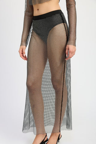 close up rhinestone maxi skirt showing scattered crystal embellishment on black fishnet mesh and solid elastic waistband