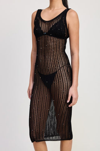 close up side detail black crochet midi dress showing open weave pattern and scattered metallic bead embellishment