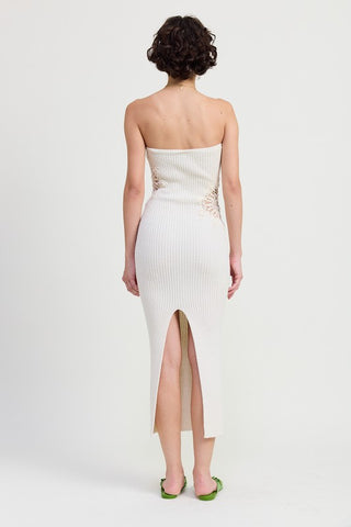 detail view crochet mandala doily patch on white ribbed knit strapless bodycon midi dress showing intricate circular open weave