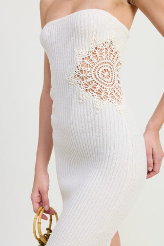 close up side hip detail white ribbed knit tube midi dress showing large circular crochet mandala doily open weave patch