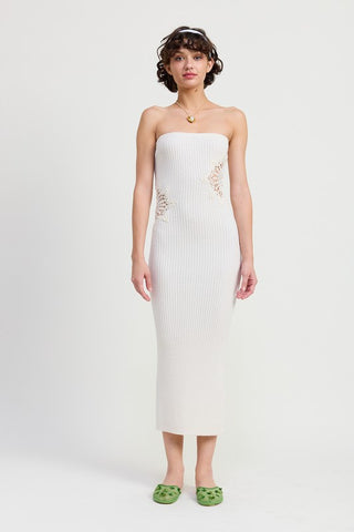 side profile white bodycon tube midi dress showing crochet mandala hip patch and straight bodycon silhouette
