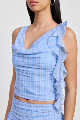 close up draped cowl neck and asymmetric cascade ruffle on blue plaid crop top showing one side ruffle panel detail