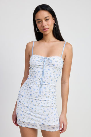 full length front view ditsy floral mini dress showing complete dress from neckline to hem with peek-a-boo sheer mesh hem