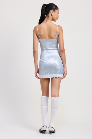alternate view ice blue metallic satin mini dress showing metallic shimmer fabric and white lace hem detail together