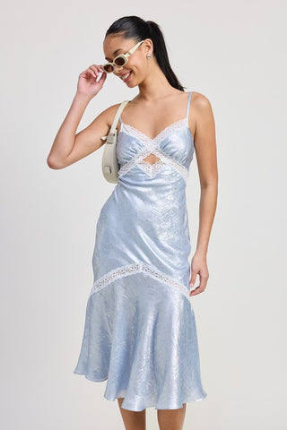 model wearing lace trim midi slip dress in baby blue with sunglasses and cream bag, full length fishtail flare view
