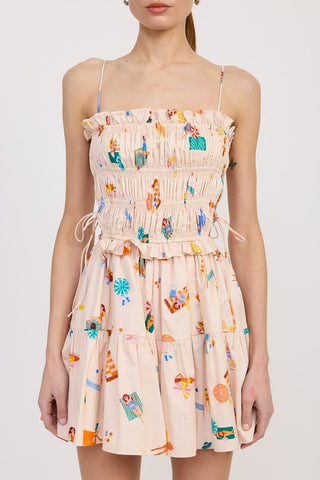 close up bodice detail cotton poplin mini dress showing smocked construction and drawstring waist tie cinch
