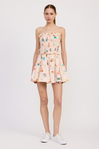 back view smocked cotton poplin mini dress showing smocked back bodice and tiered skirt silhouette