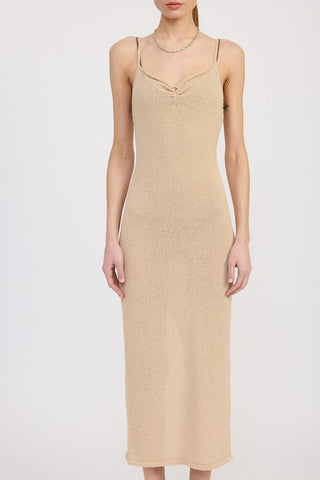 close up hem detail cream spaghetti strap midi dress showing clean hem at ankle and fitted bodycon through calf
