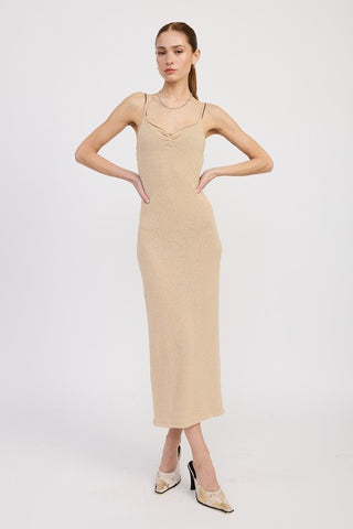 alternate styled cream bodycon spaghetti strap midi dress showing fitted silhouette from different angle