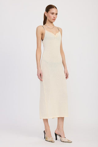 full length styled view cream spaghetti strap midi dress with cream mules and mini bag showing complete look