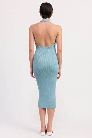 side profile teal metallic halter knit dress showing ribbed knit texture, iridescent shimmer and open halter back