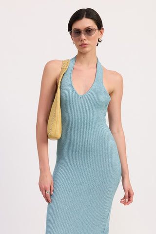 close up neckline teal metallic halter knit dress showing deep V halter construction and ribbed metallic shimmer fabric