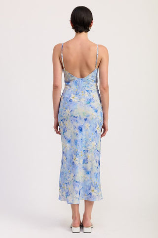 close up fabric detail blue watercolor floral satin slip midi dress showing satin sheen and impressionist floral pattern