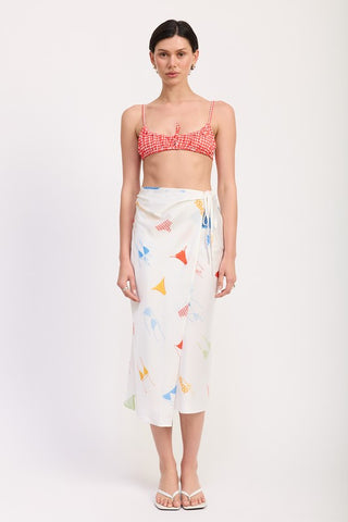 side profile printed satin midi skirt showing side ruche detail and draped sash tie at one hip