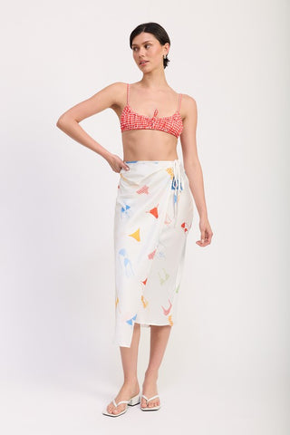 back view white printed satin midi skirt showing A line silhouette and side ruche drape from behind