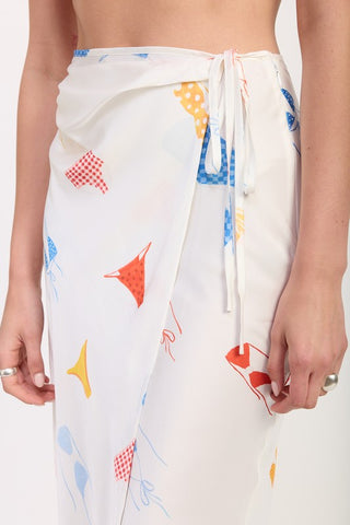 close up waist detail printed satin midi skirt showing side ruche drape and sash tie construction at hip