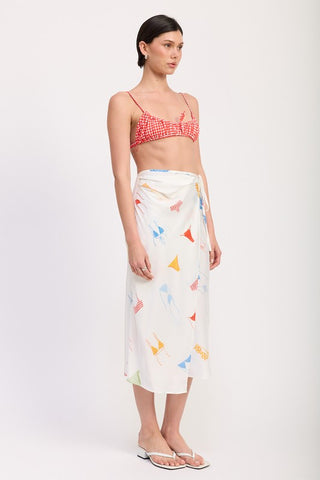 close up print detail printed satin midi skirt showing multicolor pennant bunting flags in red blue yellow green