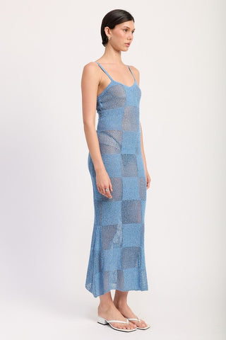 close up hem periwinkle maxi dress showing sheer and opaque checkerboard square pattern at floor length