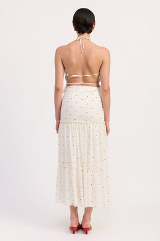 side profile cream polka dot tiered ruffle midi skirt showing two tier A-line construction and ruffle hem