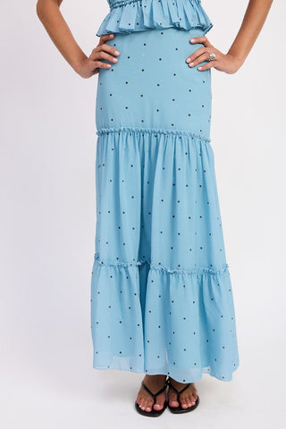 close up hem detail cream polka dot tiered midi skirt showing ruffle bottom tier and small black dot pattern