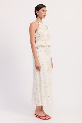 back view cream polka dot tiered ruffle midi skirt showing elastic smocked waistband and A-line tiered silhouette