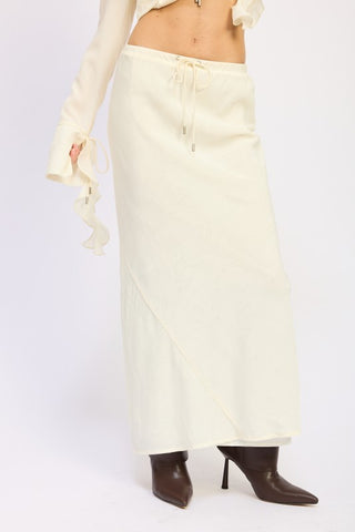three-quarter view Simone ivory jacquard satin maxi skirt showing tonal pattern and slim fitted cut