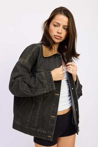 styled look black mixed media denim jacket over white tee and black jeans showing complete downtown look