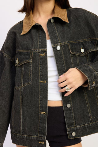 close-up collar detail black denim jacket showing camel corduroy contrast collar and button placket