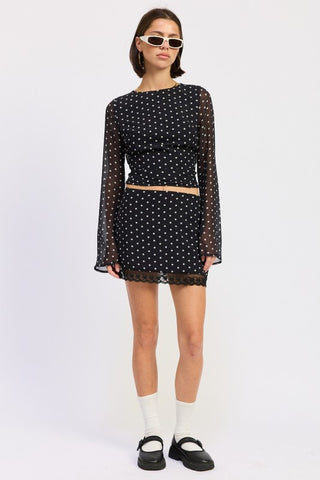 Coco polka dot mini skirt with scalloped lace hem in black white, fitted above knee length, full front view