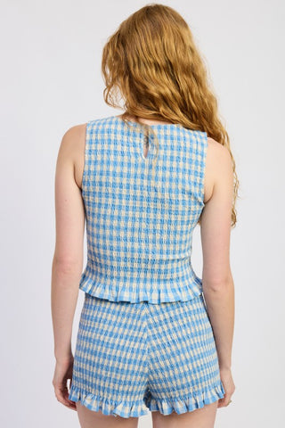 close-up lettuce hem detail blue gingham cotton crop top showing wavy stretched hem edge construction