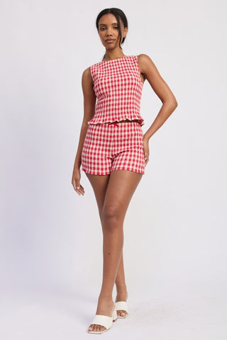 portrait close-up Poppy gingham smocked crop top showing blue cream check pattern and smocked construction detail