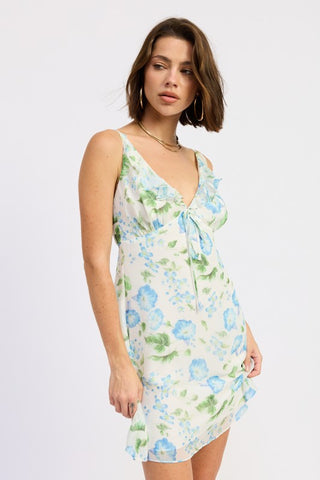 side profile model in white blue floral V-neck ruffle chiffon mini dress, flowy lightweight silhouette above knee