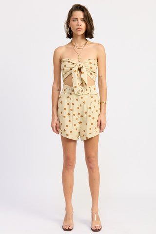 front view butter caramel polka dot tie front strapless crop top showing bow detail