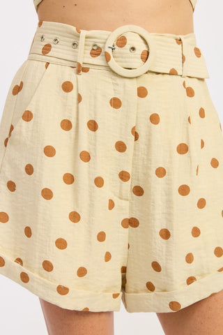 front view butter polka dot belted cuffed shorts showing ring belt hardware and high waist