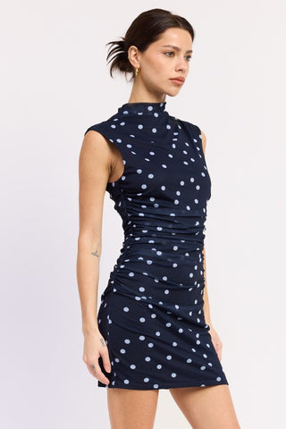 close-up hem navy polka dot mock neck mini dress showing ruched gather at hip and mini length proportion