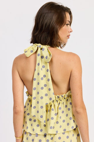 front portrait Brigitte yellow polka dot halter top with deep V neckline and cotton-lined bodice visible
