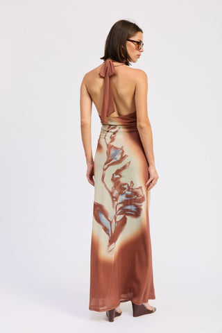 resort pose model in Rio terracotta boho halter maxi dress showing abstract print and open back detail