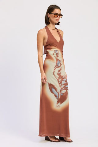 front view terracotta abstract print halter maxi dress full look showing deep V neck and floor length