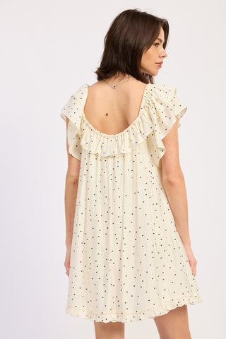 model in ivory polka dot babydoll romper with bow tie at center front neckline