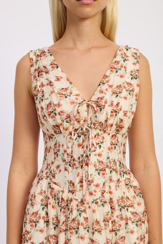 close-up bodice cream floral corset midi dress showing V-neck, corset structure, front tie bow and terracotta rose print