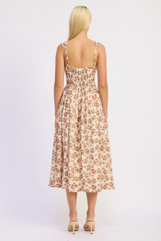 close-up lower skirt detail cream floral corset dress showing tiered construction and coral terracotta rose print