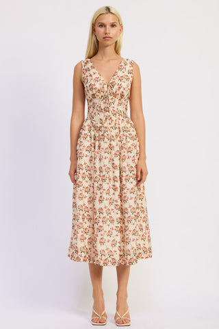 back view cream rose print corset midi dress showing tiered skirt volume from behind