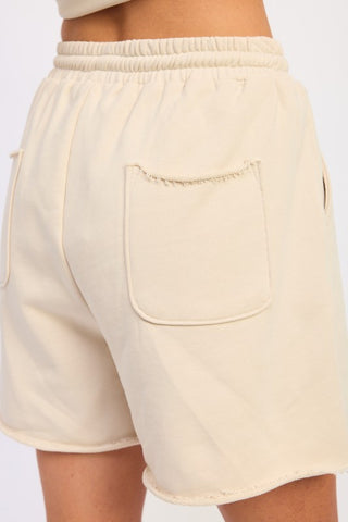 co-ord set look Scout cream French terry shorts with matching contrast collar polo crop top