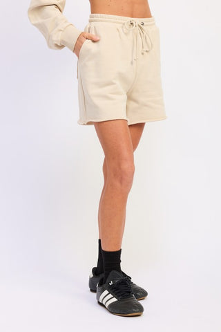 back view cream French terry drawstring shorts showing relaxed cut and cotton texture