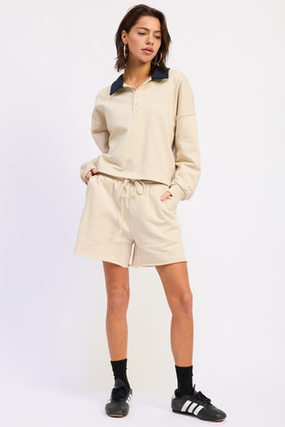 Scout French terry shorts with pockets in cream cotton, drawstring waist, mid-thigh length, relaxed fit