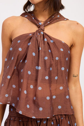 front view brown polka dot tie neck swing top showing twist at neck and loose swing fit below