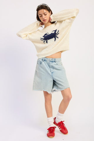 Gidget distressed denim bermuda shorts in light wash with frayed raw hem, relaxed fit above knee length