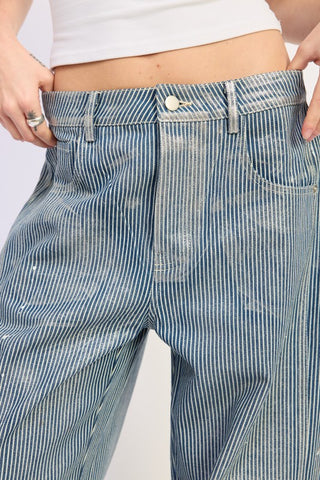 close up waist detail blue white striped baggy jeans showing railroad pinstripe fabric single button and 5 pocket construction